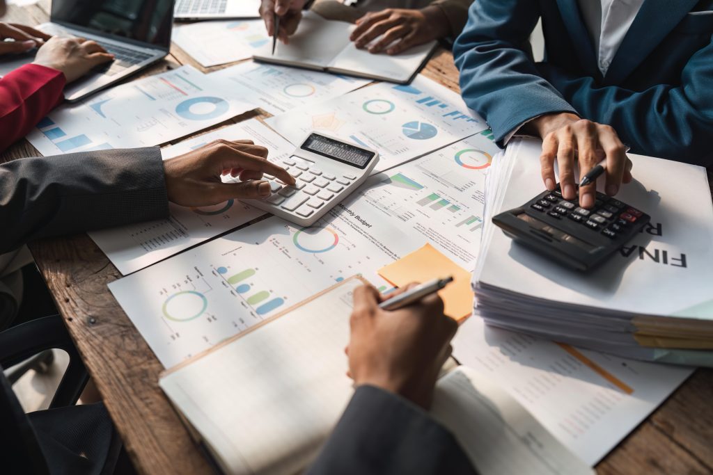 Business team meeting to conference, collaboration discussing working analyzing with financial data and marketing plan strategy project..